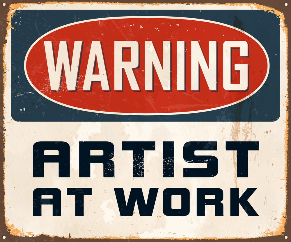 warning sign artist at work